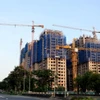 Một dự án bất động sản đang được nhà đầu tư triển khai thi công xây dựng. (Ảnh: TTXVN)