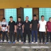 Các đối tượng trong đường dây cá độ bóng đá bị bắt giữ. (Ảnh: TTXVN phát)