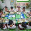 Học sinh tham gia mô hình với bữa ăn đầy đủ chất dinh dưỡng. (Ảnh: PV)