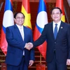 Thủ tướng Phạm Minh Chính hội kiến Thủ tướng Lào Sonexay Siphandone, Chủ tịch ASEAN 2024. (Ảnh Dương Giang/TTXVN)