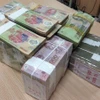 Tín dụng nền kinh tế nhích nhẹ sau 2 tháng tăng trưởng âm. (Ảnh: Vietnam+)