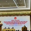 Phó Thống đốc Thường trực Ngân hàng Nhà nước Đào Minh Tú báo cáo tại Hội nghị. (Ảnh: Vietnam+)