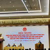 Phó Thống đốc Thường trực Ngân hàng Nhà nước Đào Minh Tú báo cáo tại Hội nghị. (Ảnh: Vietnam+)
