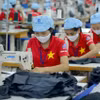 Xuất khẩu đang trên đà phục hồi. (Ảnh: Vietnam+)