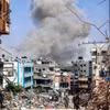 Những tòa nhà bị phá hủy sau cuộc không kích của Israel xuống Dải Gaza. (Ảnh: IRNA/TTXVN)