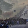 Người di cư trong hành trình tới Mỹ (Ảnh: AFP/TTXVN)
