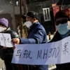 Người thân các nạn nhân trên chuyến bay MH370. (Ảnh: Reuters)