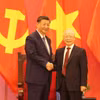 Tổng Bí thư Nguyễn Phú Trọng và Tổng Bí thư, Chủ tịch nước Trung Quốc Tập Cận Bình tại buổi gặp gỡ. (Ảnh: Trí Dũng/TTXVN)