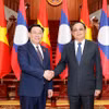 Chủ tịch Quốc hội Vương Đình Huệ và Thủ tướng Lào Sonexay Siphandone. (Ảnh: Doãn Tấn/TTXVN)