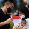 Người dân Singapore. (Ảnh: AFP/ TTXVN)