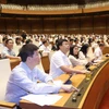 Chiều nay, Quốc hội đã chính thức Thông qua dự thảo Nghị quyết về phê chuẩn quyết toán ngân sách nhà nước 2022. (Ảnh: TTXVN)