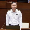 Tổng Kiểm toán Nhà nước Ngô Văn Tuấn trả lời chất vấn đại biểu Quốc hội về trách nhiệm kiểm toán các đại án thời gian qua. (Ảnh: TTXVN)
