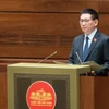 Bộ trưởng Bộ Tài chính Hồ Đức Phớc trình bày Tờ trình dự thảo Nghị quyết về việc áp dụng thuế thu nhập doanh nghiệp bổ sung theo quy định chống xói mòn cơ sở thuế toàn cầu. (Ảnh: CTV/Vietnam+)