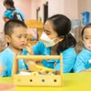 Làm việc nhiều thời gian, vất vả và áp lực, nhưng thu nhập của giáo viên mầm non chưa tương xứng. (Ảnh: PV/Vietnam+)