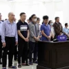 Các bị cáo tại phiên toà xét xử. (Ảnh: Phạm Kiên/TTXVN)