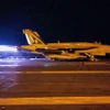 Chiến đấu cơ cất cánh từ tàu sân bay USS Dwight D. Eisenhower của Mỹ. (Ảnh: AFP/TTXVN)