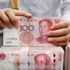 Đồng 100 nhân dân tệ của Trung Quốc. (Ảnh: AFP/TTXVN)