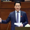 Bộ trưởng Bộ Tài nguyên và Môi trường Đặng Quốc Khánh trả lời chất vấn. (Ảnh: Phạm Kiên/TTXVN)