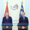 Tổng Bí thư Tô Lâm với Thủ tướng Malaysia Anwar Ibrahim tại buổi họp báo. (Ảnh: Thống Nhất/TTXVN)