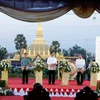 Thủ tướng Sonexay Siphandon và các quan khách Lào cắt băng khai mạc Năm Du lịch Lào 2024. (Ảnh: Phạm Kiên/TTXVN) 