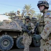 Binh sỹ Australia gác tại lối vào Đại sứ quán Australia ở thủ đô Baghdad, Iraq. (Ảnh: AFP/TTXVN)