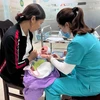 Tiêm vaccine phòng, chống bệnh ho gà cho trẻ nhỏ. (Ảnh: Thùy Dung/TTXVN) 