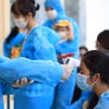 Việt Nam trải qua 2 giai đoạn chống dịch COVID-19 với 4 đợt bùng phát dịch. (Ảnh: TTXVN/Vietnam+)