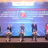 Các đại biểu ấn nút ra mắt hệ thống giám sát và quản lý thông tin bệnh lao phiên bản nâng cấp (VITIMES). (Ảnh: PV/Vietnam+)