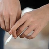 Việt Nam đang đưa ra nhiều giải pháp để giảm số người hút thuốc lá. (Ảnh: TTXVN/Vietnam+)