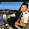 Cơ phó của hãng hàng không Vietnam Airlines tiếp bước truyền thống gia đình với nghề phi công. (Ảnh: CTV/Vietnam+)