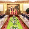Thủ tướng Phạm Minh Chính hội kiến Tổng Bí thư, Chủ tịch Trung Quốc Tập Cận Bình. (Ảnh: Dương Giang/TTXVN)