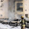Xe ôtô bị cháy sau một cuộc tấn công bằng rocket từ Dải Gaza tại Ashkelon (Israel). (Ảnh: AFP/TTXVN)