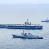 Tàu khu trục Seoae Ryu Seong-ryong của Hàn Quốc, tàu sân bay chạy bằng năng lượng hạt nhân USS Theodore Roosevelt của Mỹ và tàu khu trục Ariake của Nhật Bản tham gia cuộc tập trận chung ngoài khơi đảo Jeju (Hàn Quốc), ngày 11/4/2024. (Ảnh: Yonhap/TTXVN)
