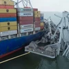 Hiện trường vụ tàu container Dali đâm sập cầu ở cảng Baltimore hôm 26/3. (Ảnh: AFP/TTXVN)