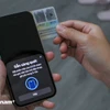 Dù có 13 triệu khách hàng đã hoàn thành sinh trắc học nhưng vẫn còn nhiều người gặp khó. (Ảnh: Vietnam+) 