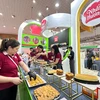 Mỗi doanh nghiệp tham gia Triển lãm Quốc tế Thực phẩm và Đồ uống Việt Nam lần thứ 10 tại Hà Nội đều mang đến những sản phẩm chất lượng, kỳ vọng đưa thương hiệu đến gần hơn với các đối tác và người tiêu dùng. (Ảnh: Xuân Quảng/Vietnam+)