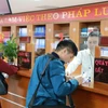 Người dân được phục vụ tốt hơn nhờ đẩy mạnh công tác Chuyển đổi Số. (Ảnh: PV/Vietnam+)