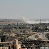 Khói bốc lên trong cuộc giao tranh tại Daraa, Syria. (Ảnh: THX/TTXVN)