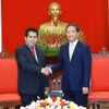 Trưởng Ban Kinh tế Trung ương Trần Tuấn Anh tiếp Tổng Bí thư Đảng Cộng sản Peru Luis Alberto Villanueva Carbajal. (Ảnh: Phương Hoa/TTXVN)