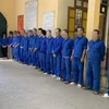 Nhóm đối tượng bị khởi tố, bắt giam. (Ảnh: TTXVN phát)
