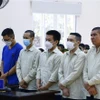 Các bị cáo tại phiên tòa ngày 16/10. (Ảnh: Huyền Trang/TTXVN)