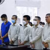 Các bị cáo tại phiên tòa ngày 16/10. (Ảnh: Huyền Trang/TTXVN)