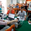 Một buổi giao dịch cho hộ nghèo, đối tượng chính sách vay vốn tại điểm giao dịch xã Vĩnh Ninh, huyện Quảng Ninh, tỉnh Quảng Bình. (Ảnh: Trần Việt/TTXVN)