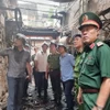 Thượng tướng Trần Quốc Tỏ có mặt tại hiện trường vụ cháy sáng 24/5. (Ảnh: Phạm Kiên/TTXVN)