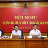Bộ trưởng Bộ Tư pháp Lê Thành Long và các đại biểu chủ trì hội nghị. (Ảnh: Phạm Kiên/TTXVN)