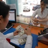 Chuyên gia UOB nhận định tỷ giá ngoại tệ sẽ hạ nhiệt vào cuối năm. (Ảnh: Vietnam+)