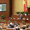 Chánh án Tòa án Nhân dân Tối cao Nguyễn Hòa Bình trả lời chất vấn. (Ảnh: Doãn Tấn/TTXVN)