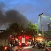 Hiện trường xảy ra vụ cháy tại Cầu Giấy tối 26/6. (Ảnh: PV/Vietnam+)