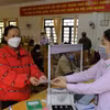 Ngân hàng Chính sách Xã hội giải ngân cho vay hỗ trợ việc làm và cho vay học sinh, sinh viên. (Ảnh: Đặng Tuấn/TTXVN)