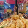 Người dân mua hàng tại siêu thị, (Ảnh: Đức Duy/Vietnam+)